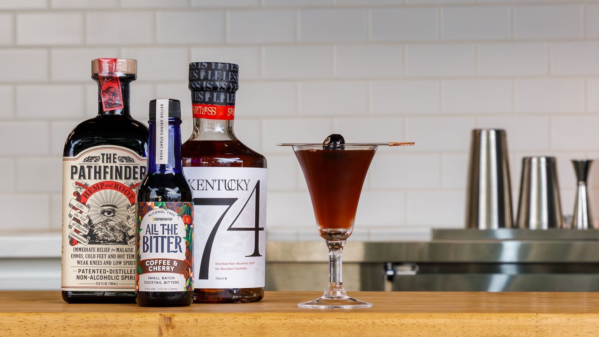 Photo of a Black Manhattan mocktail made with Pathfinder, Kentucky 74, and All The Bitter coffee bitters.