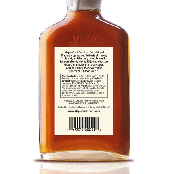 Bottle of Maple Craft Bourbon Barrel Aged Maple Syrup with label on a white background