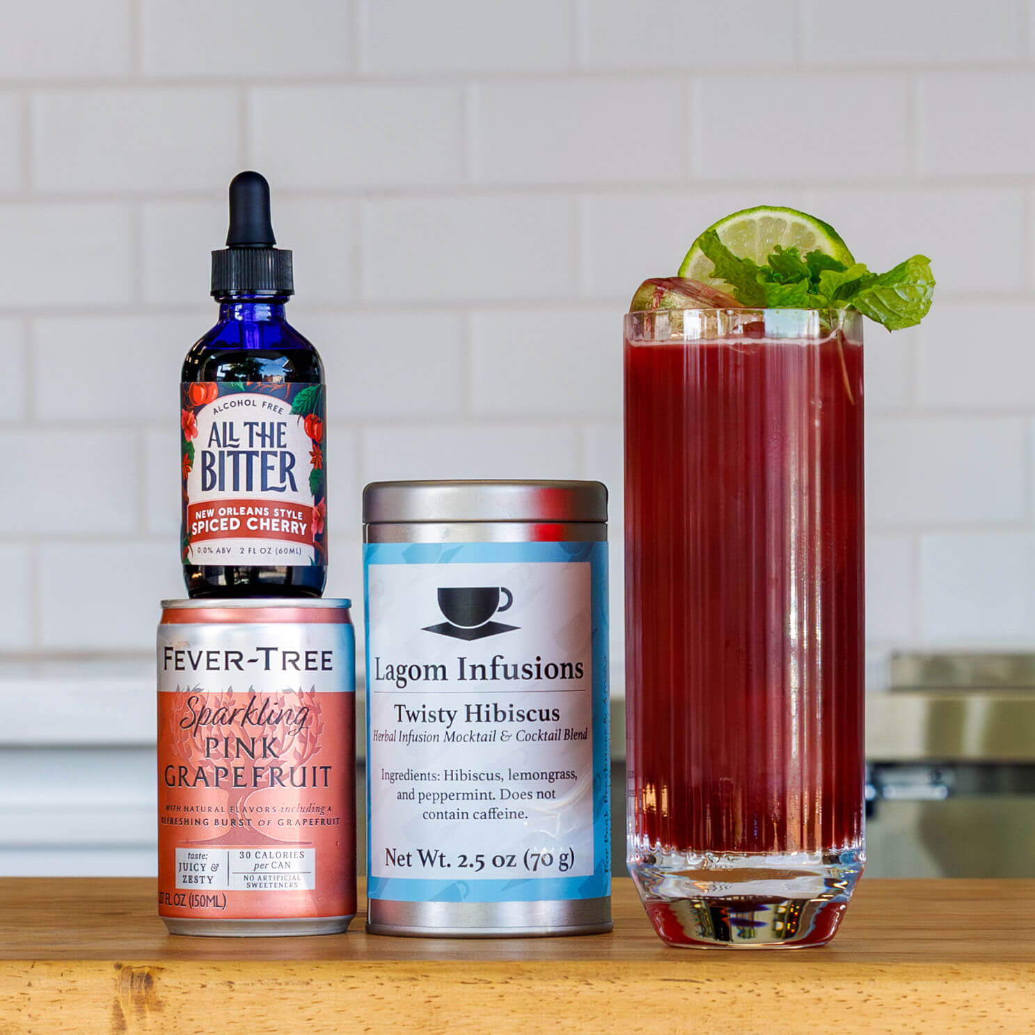 Hibiscus Paloma mocktail with tea, grapefruit soda, and All The Bitter non-alcoholic cherry bitters.