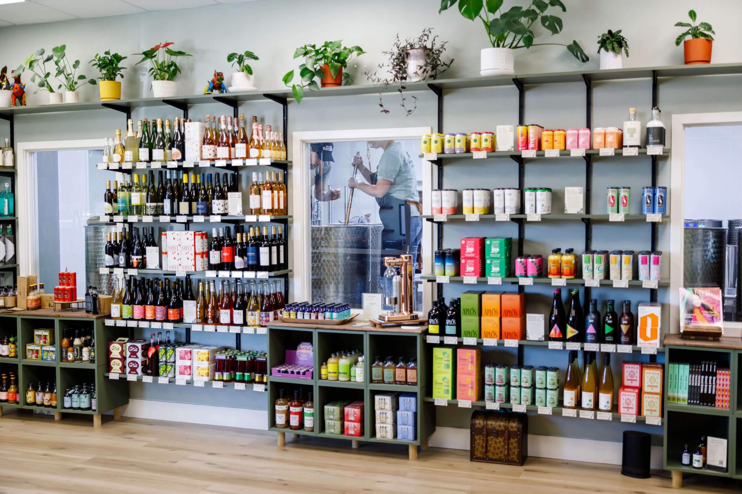 Non-alcoholic bottle shop stocked with non-alcoholic spirits, wines, and functional drinks like kava mocktails.