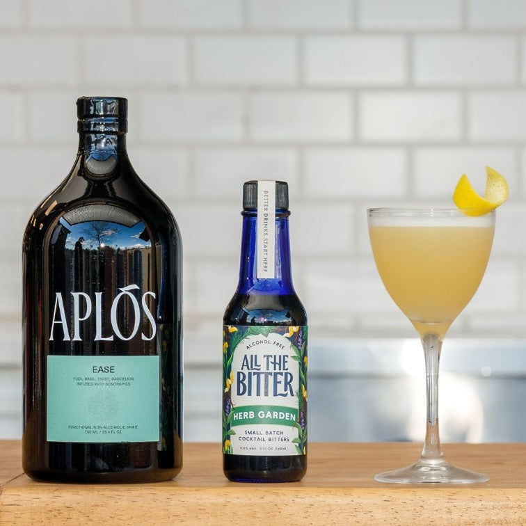 Nonalcoholic sour cocktail made with Aplos Ease, lemon juice, and herb garden bitters.