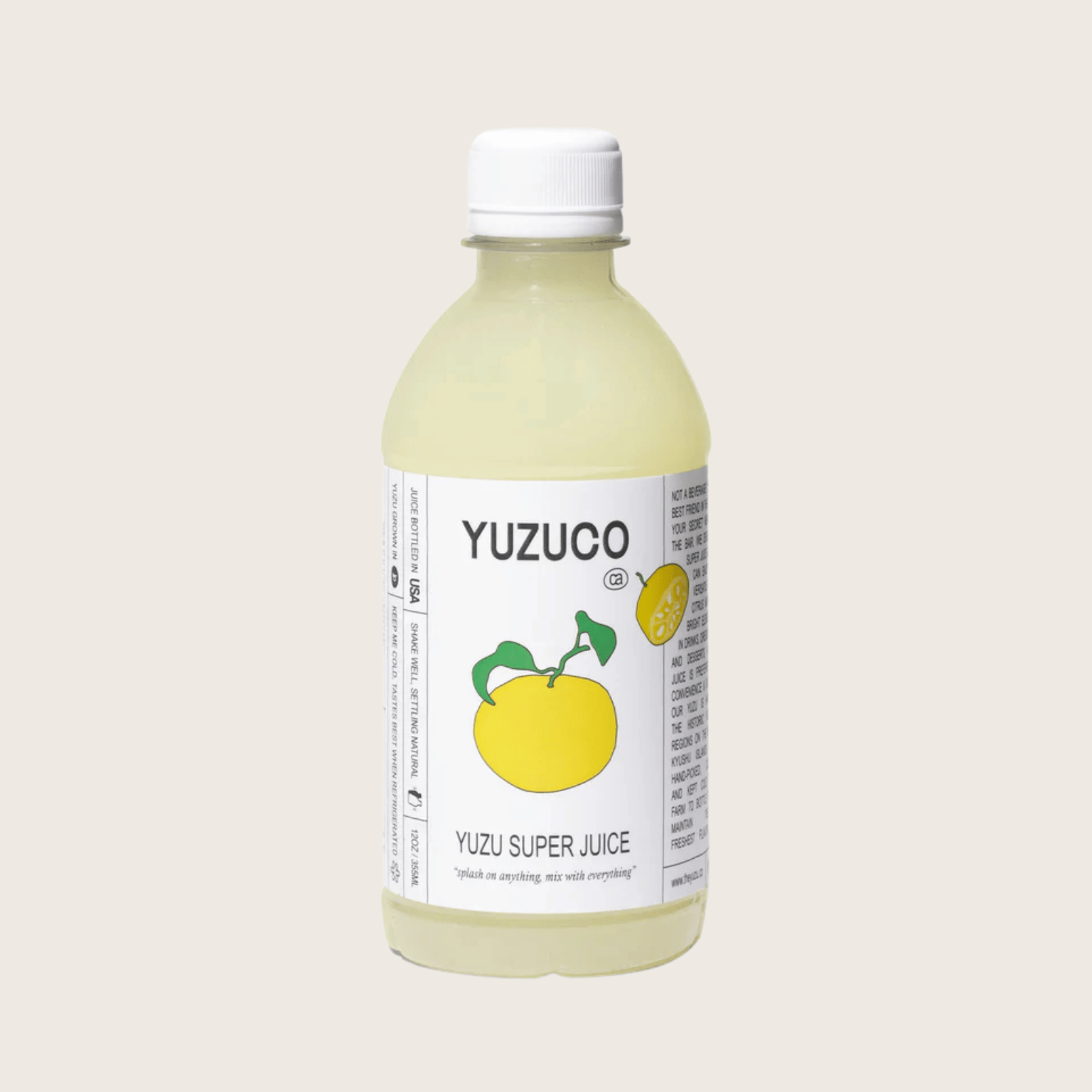 Bottle of Yuzuco Yuzu Super Juice on a light beige background